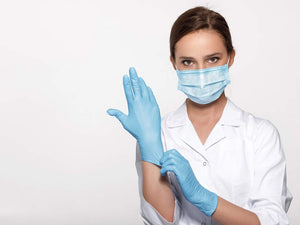 Doctor wearing PPE Gloves and Mask